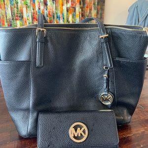 Michael Kors purse with matching wallet.